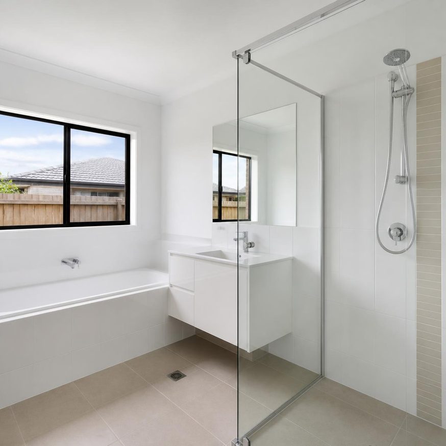 Bathroom after a CleanArt bond clean in Pimpama, Gold Coast — shower screen, tiles, vanity and bath cleaned