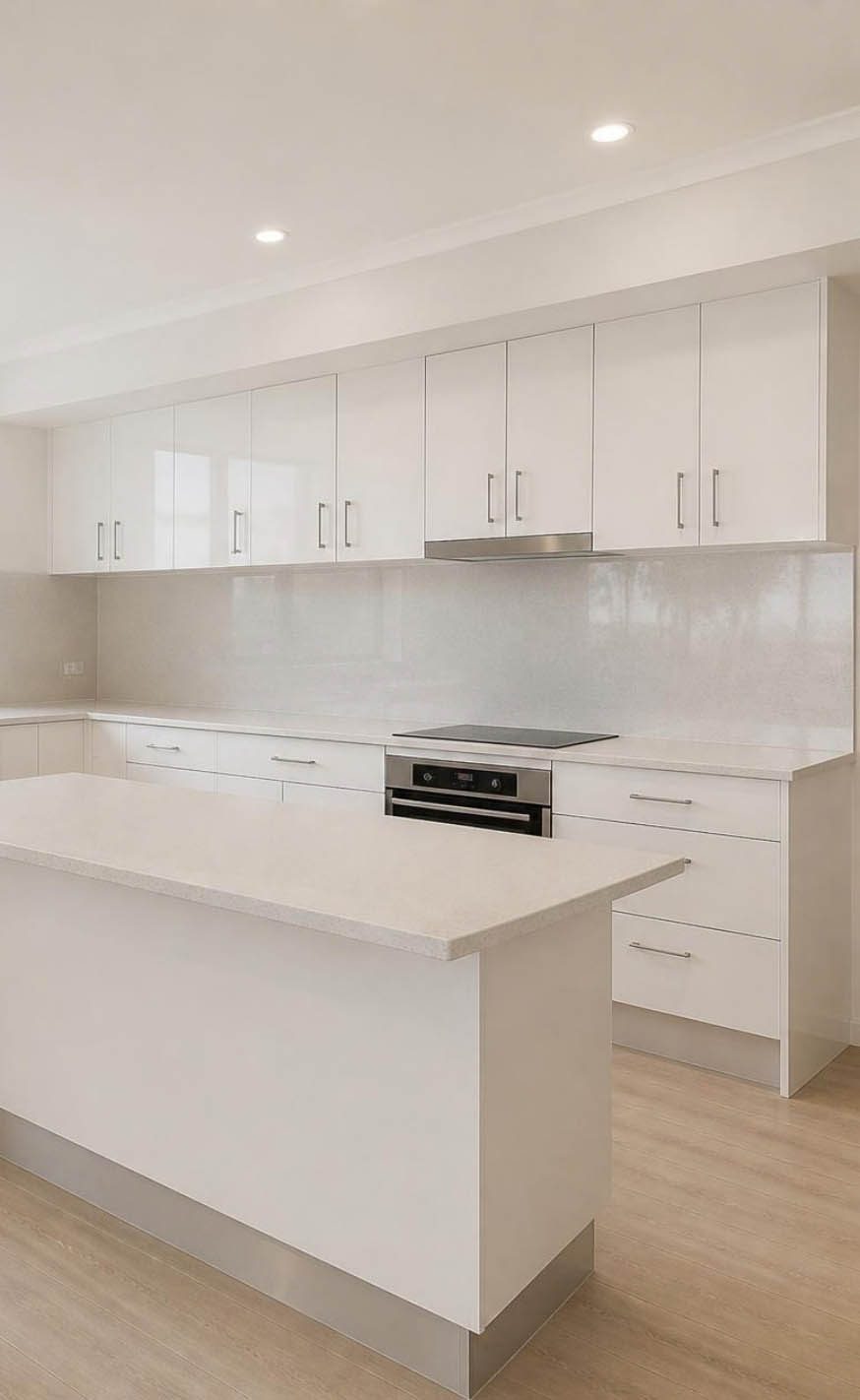 Kitchen after a CleanArt bond clean in Southport, Gold Coast — benchtops, splashback, oven and cabinetry cleaned